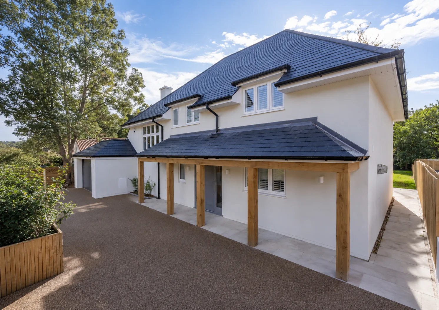 Contemporary chalet-style new build home with oak-framed entrance canopy, completed by Morgan Design & Construction at Canford Cliffs, Poole